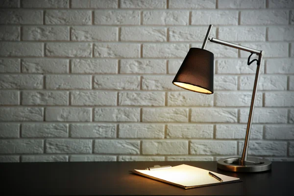 Modern lamp on desk — Stock Photo, Image