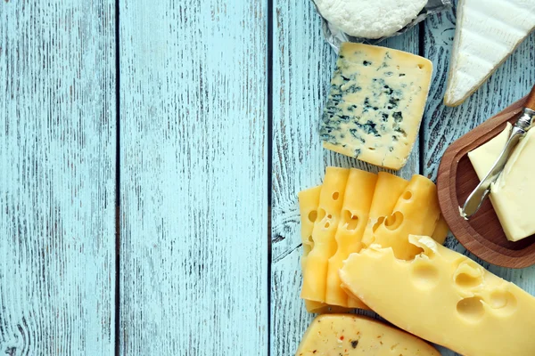 Frame of fresh dairy products on blue wooden table — Stock Photo, Image