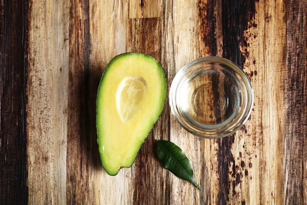 Fresh avocado  on wooden table, top view — Stock Photo, Image