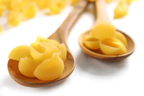 Italian pasta on wooden spoons — Stock Photo, Image