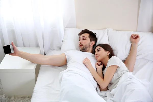 Couple waking up after a night sleep. — Stock Photo, Image