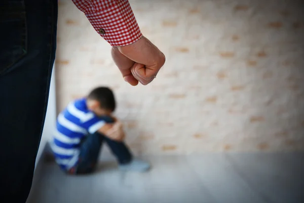 Father Fist Punishment Little Boy Sitting Floor Indoors — Stock Photo, Image