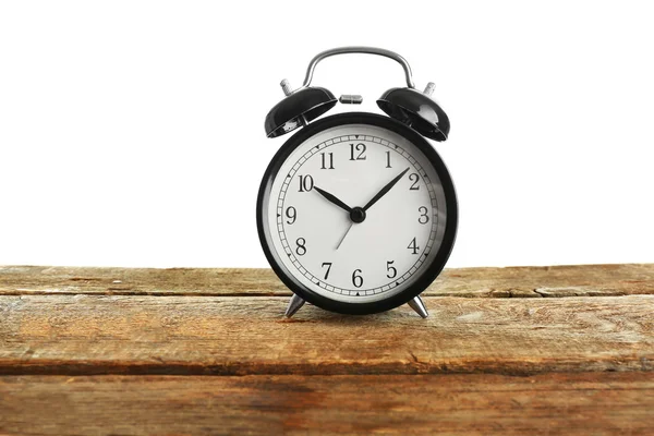 Alarm clock on wooden table. — Stock Photo, Image