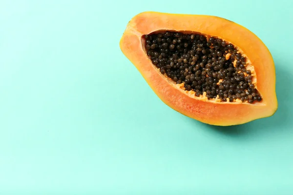 Halved papaya on blue — Stock Photo, Image