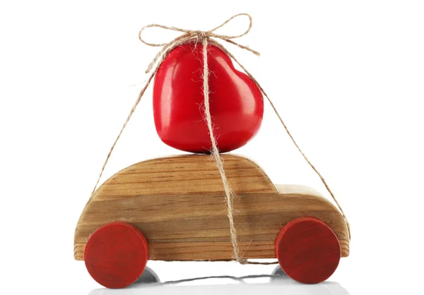 Wooden car with a red heart  tied to it, isolated on white — Stock Photo, Image