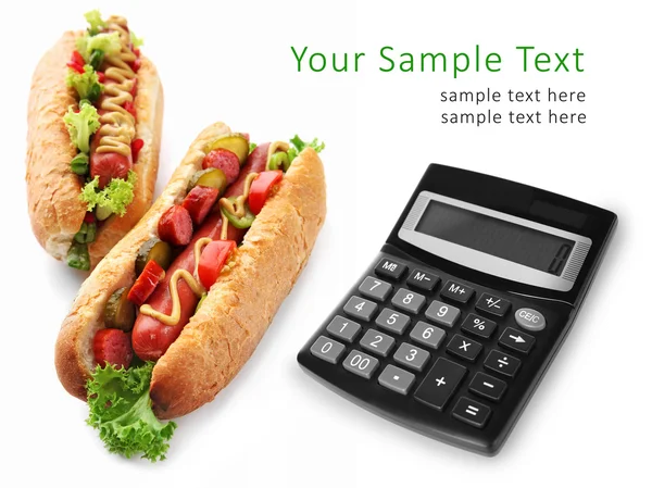 Calculator and tasty hot dogs — Stock Photo, Image