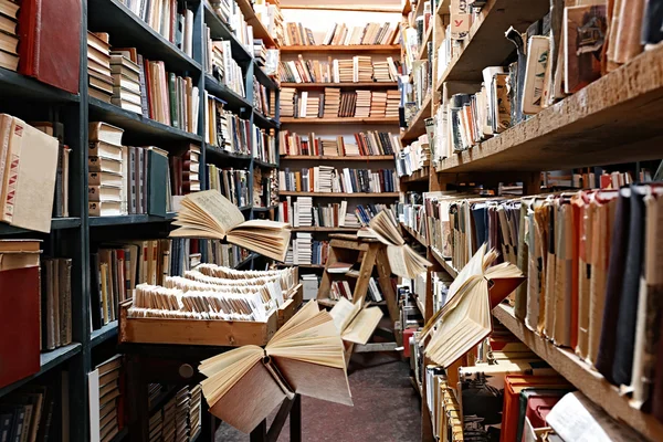 Flying books on library bookshelves