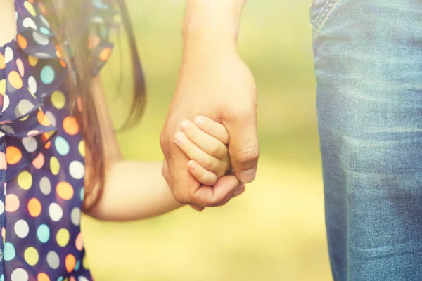 Father's hand lead his child daughter outdoors, trust family concept — Stock Photo, Image