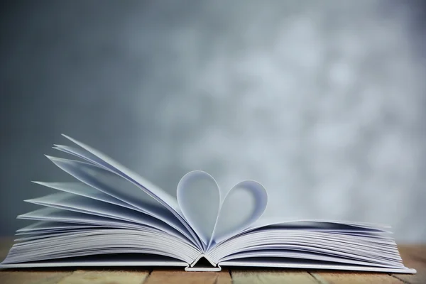 Sheets of book curved into heart shape — Stock Photo, Image