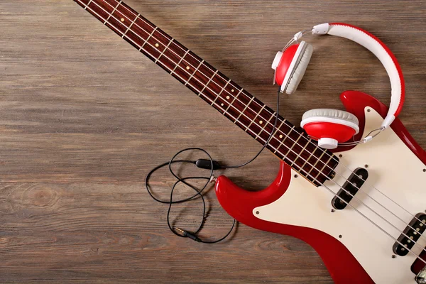 Electric guitar with headphones — Stock Photo, Image