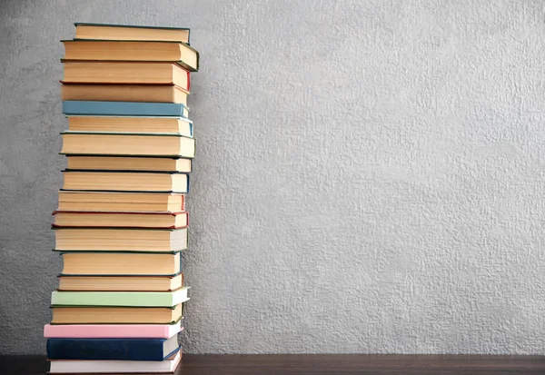 Stack of books on grey — Stock Photo, Image