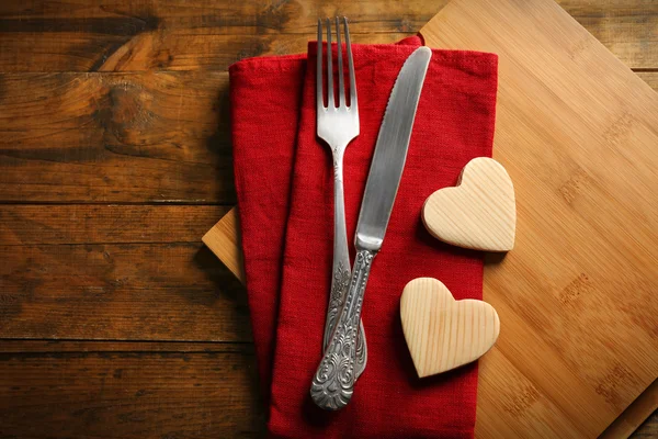 Composition of fork, knife, napkin — Stock Photo, Image