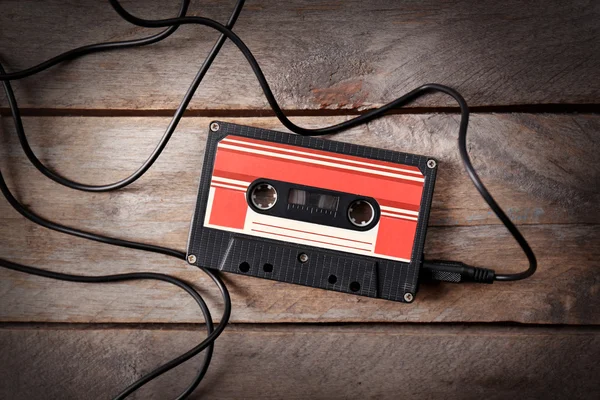 Retro cassette on wooden table — Stock Photo, Image