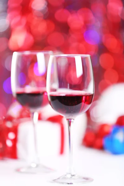 Wineglasses on red blurred lights background — Stock Photo, Image