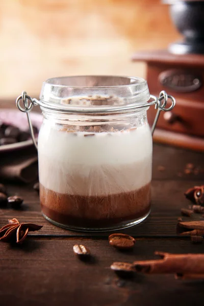 Delicious vanilla-chocolate mousse on wooden background, close up — Stock Photo, Image