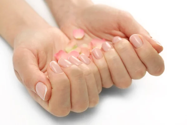 Woman hands with rose petals — Stock Photo, Image