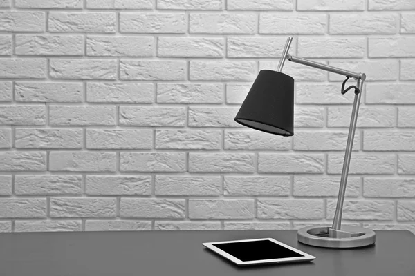 Modern lamp on desk — Stock Photo, Image