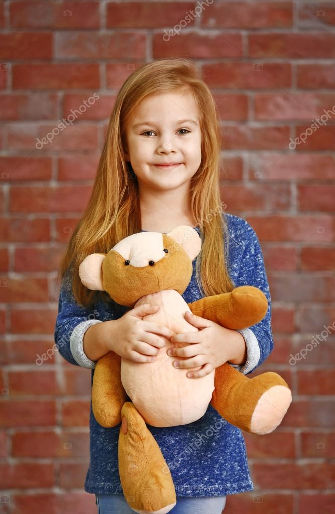 girl and teddy bear