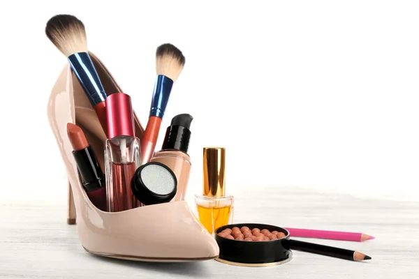 Makeup set with beige woman's shoe — Stock Photo, Image