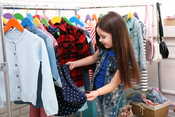 Little girl trying on a new dress — Stock Photo, Image
