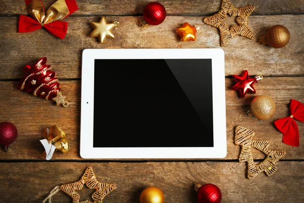 Tablet and Christmas decor — Stock Photo, Image