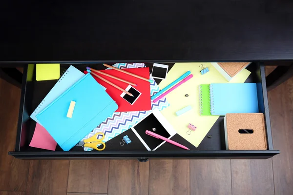 Stationery in open desk drawer — Stock Photo, Image