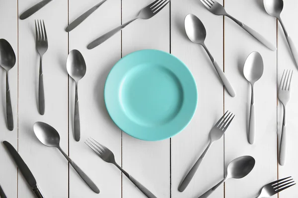 Plate and silver flatware — Stock Photo, Image