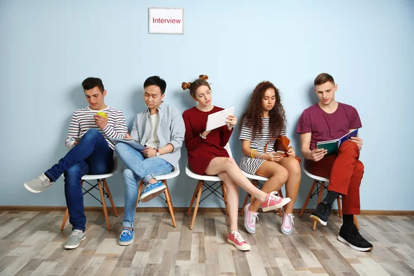 Group of people waiting for interview indoors