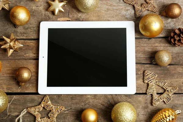 Tablet and Christmas decor — Stock Photo, Image