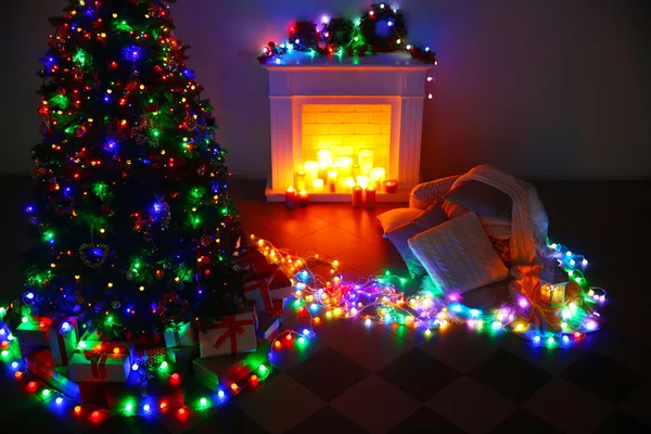 Christmas tree near fireplace — Stock Photo, Image