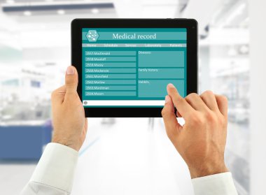 Medical tablet in doctor hands clipart