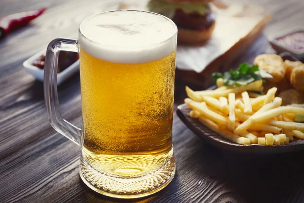 Glass mug of light beer — Stock Photo, Image