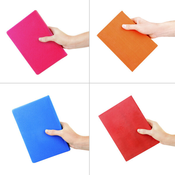 Hand holding bright color book