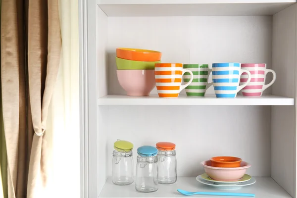 Tableware on shelves in the kitchen — Stock Photo, Image