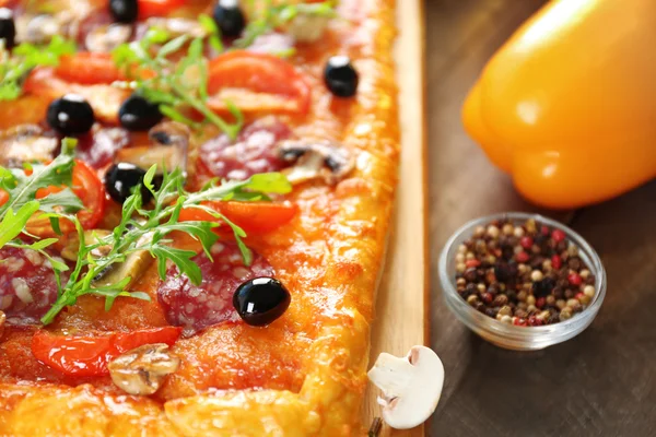 Rectangle delicious pizza and vegetables — Stock Photo, Image