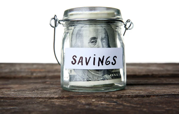 Jar for savings full of banknotes — Stock Photo, Image