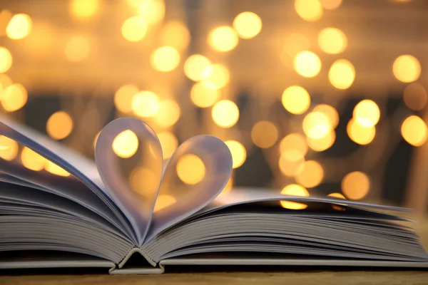 Sheets of book curved into heart shape