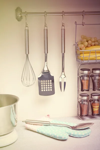 Set of cutlery hanging on wall — Stock Photo, Image