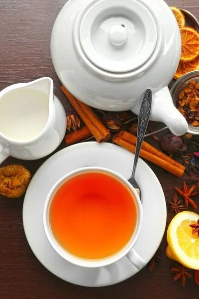 Cup of tea and delicious ingredients — Stock Photo, Image