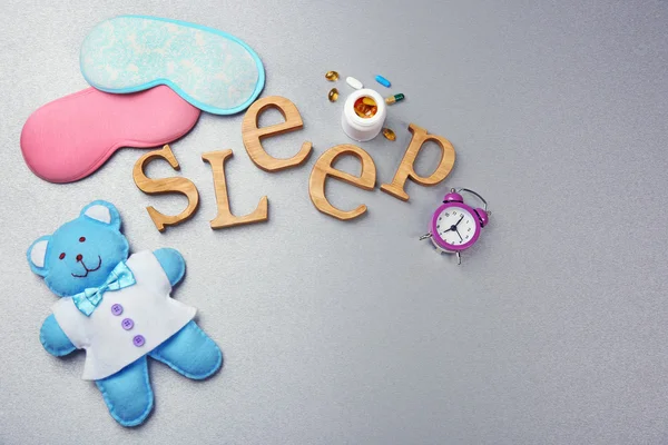 Word Sleep with pills, sleeping mask — Stock Photo, Image