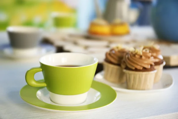 Table setting with tea and cakes — Stock Photo, Image