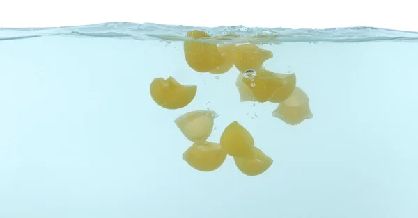 Falling pasta in water — Stock Photo, Image