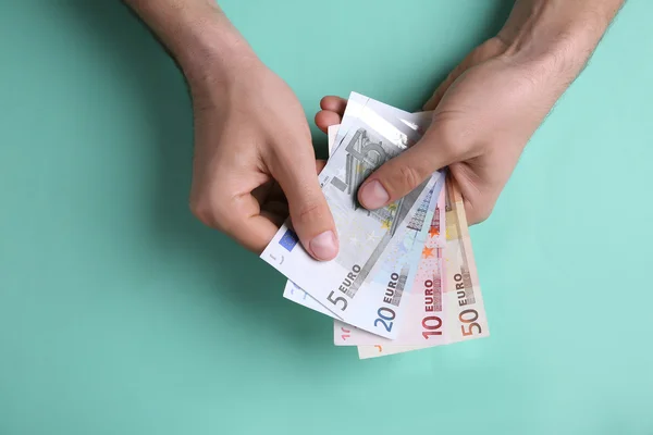 Male hands counting euro banknotes — Stock Photo, Image