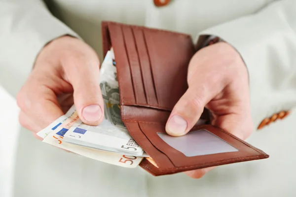 Female hands holding leather purse — Stock Photo, Image