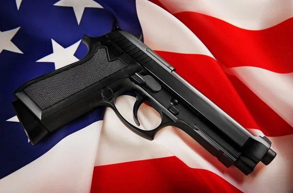 Gun on USA flag — Stock Photo, Image