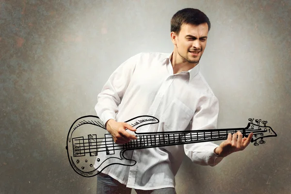 Young man pretending to play guitar — Stock Photo, Image