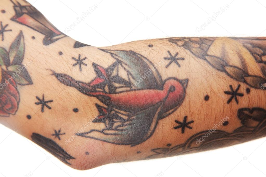 Bird tattoo on male elbow