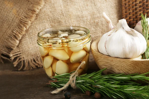 Garlic with spices on table — Stock Photo, Image