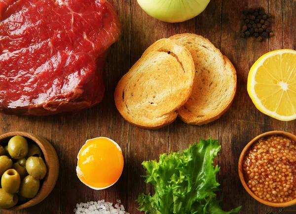 Beef tartare ingredients on board — Stock Photo, Image