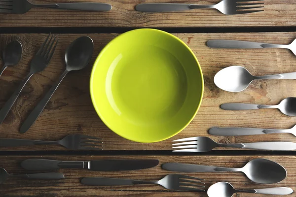 Plate and silver cutlery — Stock Photo, Image
